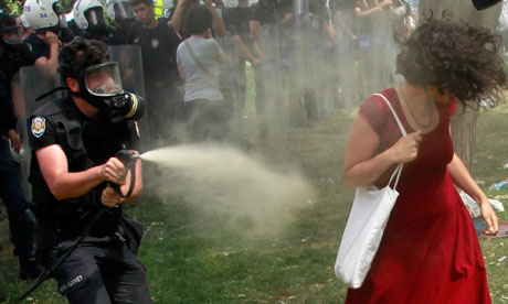 Shower of pepper spray turns woman in a red dress into Turkeys image of resistance